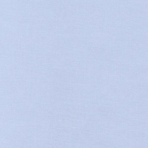 May include: A solid light blue fabric with a subtle textured appearance. The material has a soft, matte finish and a consistent color throughout. The fabric appears to be a plain weave, suitable for apparel or home decor.