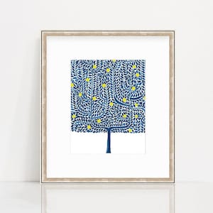 May include: A framed print of a stylized blue tree with yellow leaves. The tree is set against a white background.