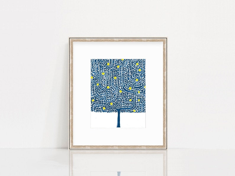 May include: A framed print of a stylized blue tree with yellow leaves. The tree is set against a white background.