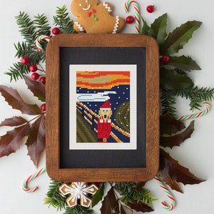 May include: A framed cross-stitch artwork depicting a pixelated version of Edvard Munch's "The Scream" with Santa Claus in the center. The artwork is surrounded by Christmas decorations, including candy canes, gingerbread cookies, and holly.