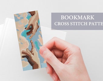 May include: A cross stitch bookmark pattern featuring two hands reaching towards each other, with a blue and white background.