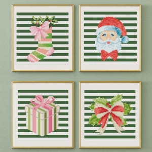 May include: Four framed Christmas-themed cross-stitch art pieces. Each features a design on a green and white striped background. Designs include a stocking, Santa Claus, a gift box, and a bow with holly.