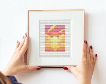Peut inclure: Une œuvre d'art en pixels encadrée représentant un coucher de soleil aux teintes orange, jaune et rose. Le cadre est de couleur or clair.