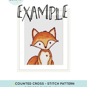 May include: A counted cross stitch pattern of a fox with a heart on its chest. The pattern is for Aida 14 count fabric and uses the DCM color palette. The text "EXAMPLE" is written above the fox.