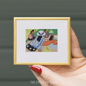 May include: Cross stitch pattern of three people sitting on a bench. The people are wearing colorful clothing and the background is a green and blue landscape.