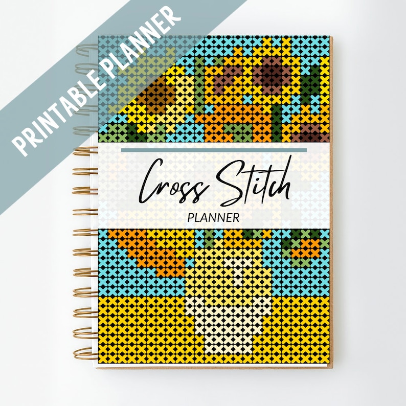 Pode incluir: Um planejador de ponto cruz imprim&iacute;vel com um design de girassol colorido. A capa apresenta um fundo preto com padr&otilde;es de ponto cruz amarelos, laranja, azuis e verdes.