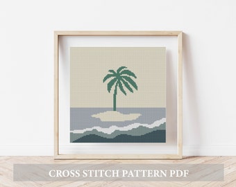Peut inclure: Un motif de point de croix représentant un palmier sur une petite île dans l'océan. Le motif est dans des tons de vert, bleu et beige.