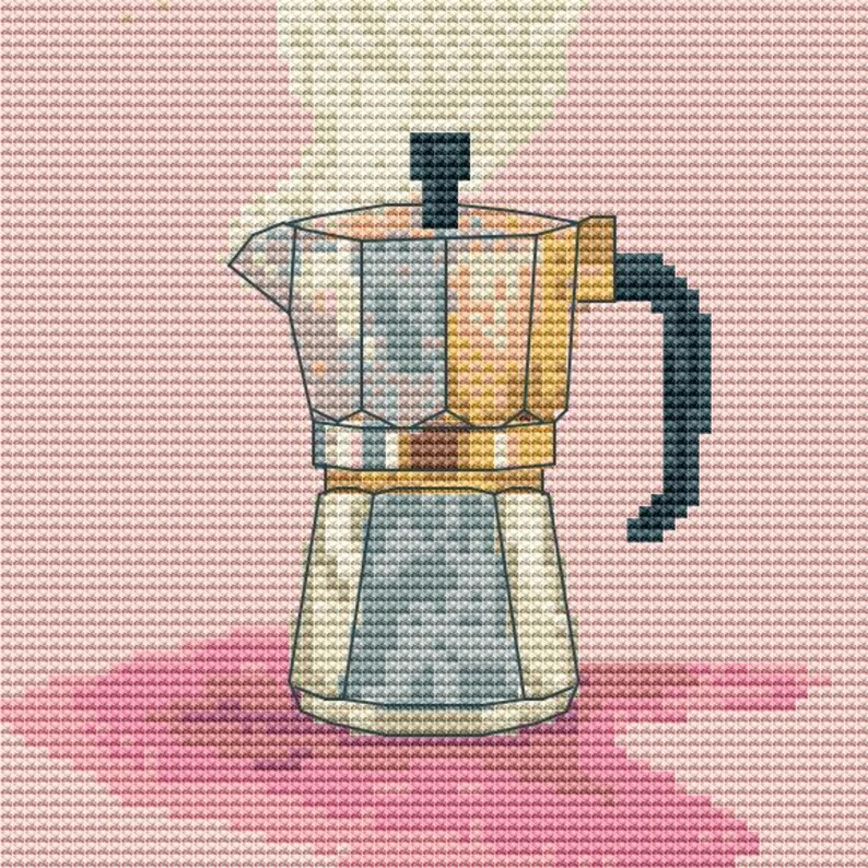 May include: A silver and gold coffee maker with a black handle, sitting on a pink surface. Steam is rising from the top of the coffee maker.