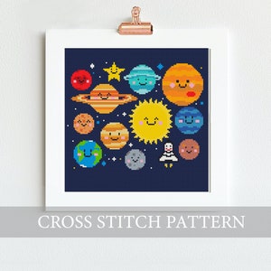 May include: A cross stitch pattern featuring a colorful depiction of the solar system with planets, stars, and a rocket. The planets have smiling faces and are arranged in a circular pattern against a dark blue background.