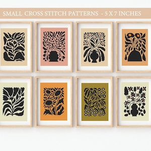 May include: Set of eight cross stitch patterns featuring black silhouettes of floral arrangements in vases, each pattern is framed in a light wood frame and set against a white background. The patterns are 5x7 inches.