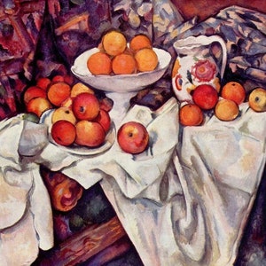 May include: A still life painting featuring a white tablecloth with a bowl of oranges and a pitcher with floral designs. The bowl and pitcher are on a wooden table with a red and blue patterned cloth in the background. There are also apples on the table.