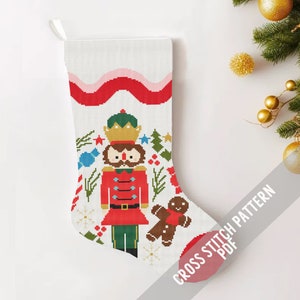 May include: A cross stitch pattern for a Christmas stocking featuring a Nutcracker soldier, a gingerbread man, and holiday decorations. The pattern is in PDF format.
