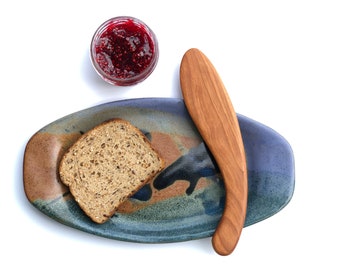 Esparcidor de madera para bagels con forma de pez