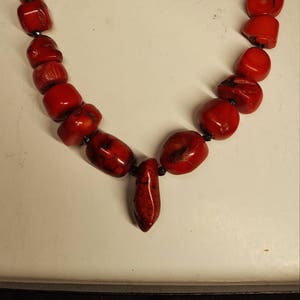 Red Coral and black sapphire necklace, 15.25 inches long.