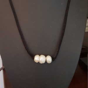 White Pearls, Leather and stainless clasp necklace, 17 inches long.