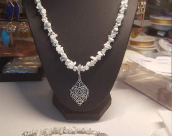 Beautiful silver pendant with silver CZ studded bail on 18 inch long white howlite and silver beaded necklace with CZ silver safety clasp.