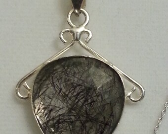 Black Rutile faceted pendant in 925 silver bezel and chain.