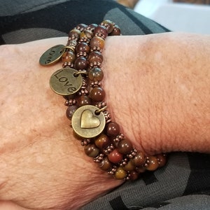 Jasper and copper stretchy bracelet with brass love/heart charm. one strand.