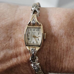 Ladies 1940s Elgin 14 K Yellow gold watch with diamonds. Stretch band.