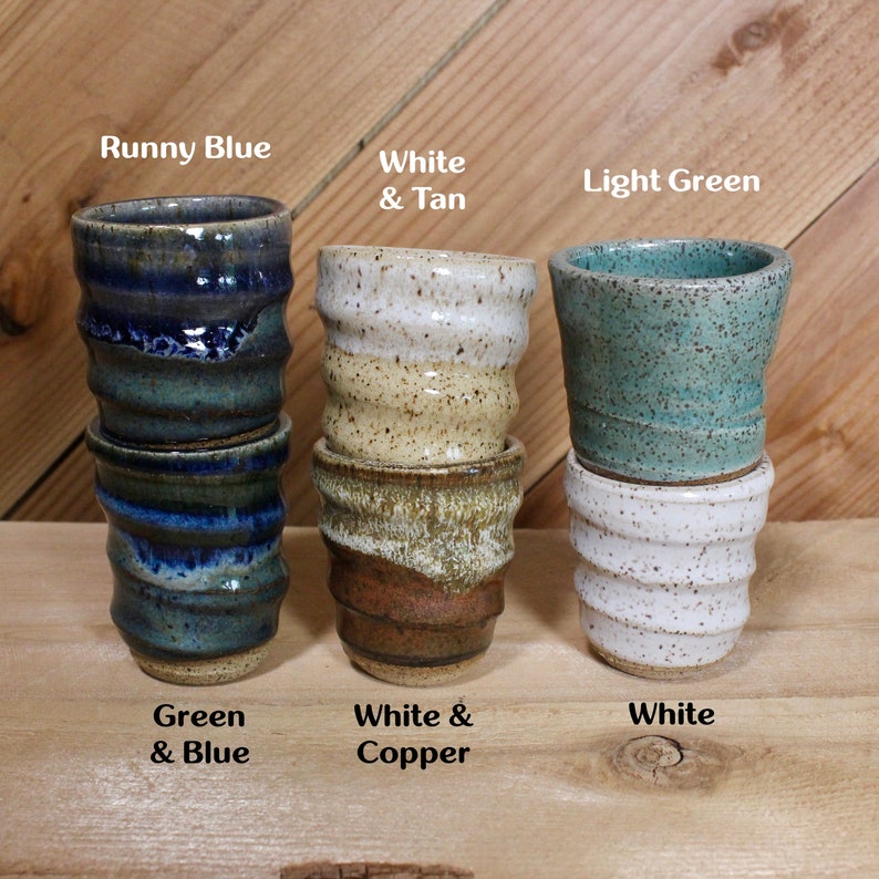 Set of speckled ceramic shot glasses with names of some color options