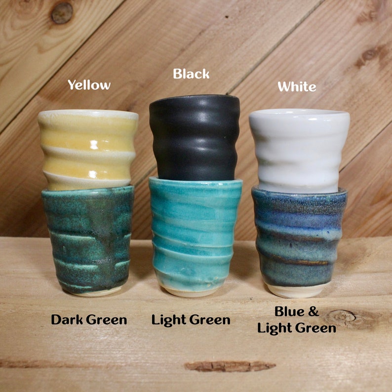Set of ceramic shot glasses with specific glaze names