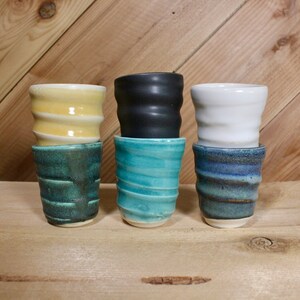 Set of ceramic shot glasses with some of the available color options