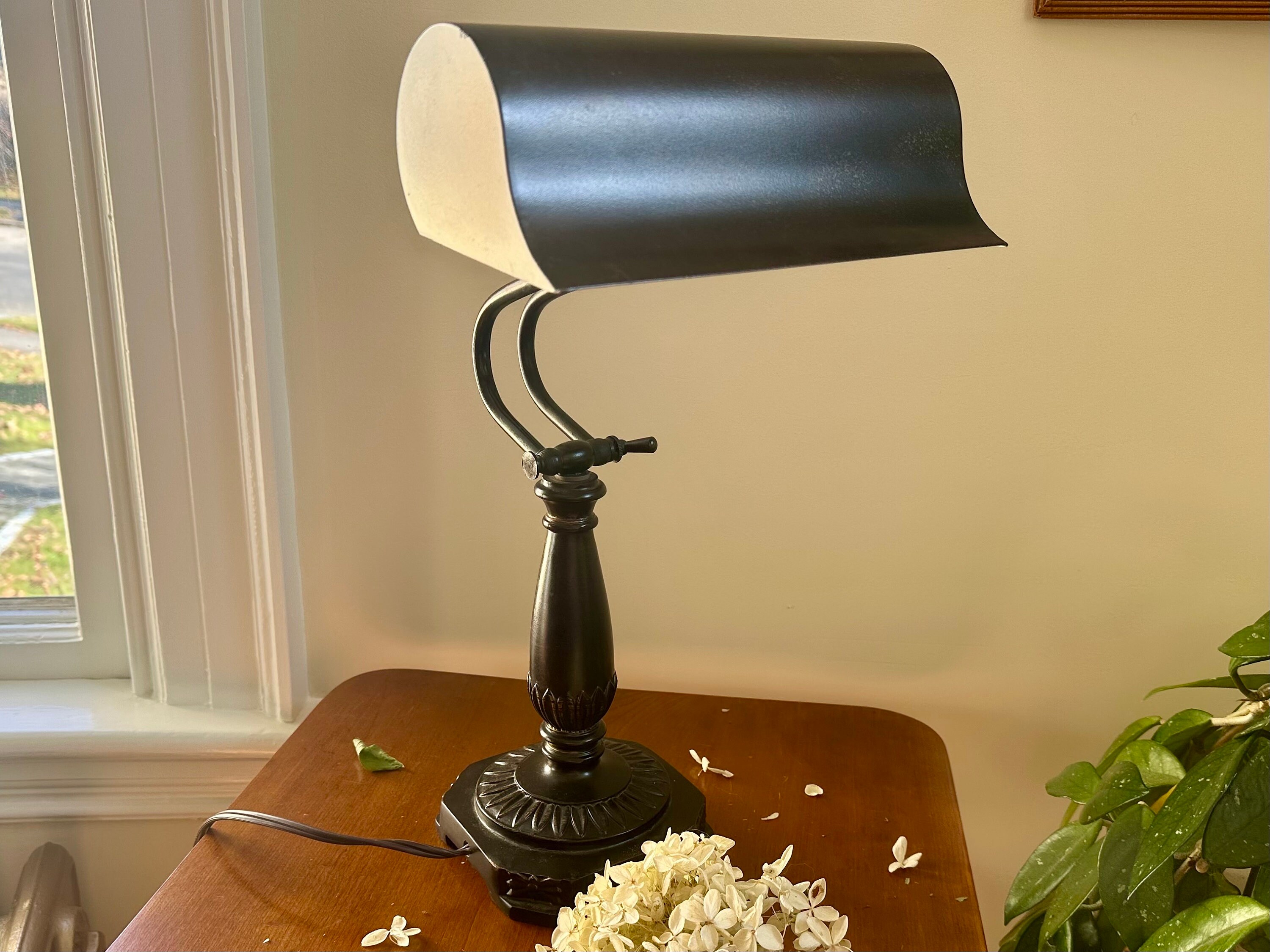 Hinged outlet desk lamp