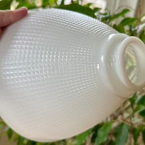 May include: White frosted glass lampshade with a diamond pattern. The shade is oval shaped and has a smooth, white finish.