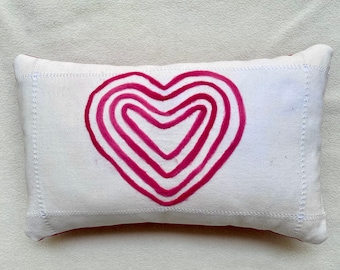 Unique pillows with felted wool hearts in ivory/red and ivory/bright pink to brighten your home