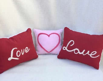 Unique “Love” and heart designs on decorative linen and chenille pillows