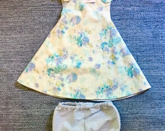 Adorable reversible sundresses with matching bloomers in sweet blue floral cotton. Size 12M and 2T.