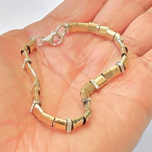 Pulsera de circonitas en plata de ley 925 y oro amarillo de 14 quilates