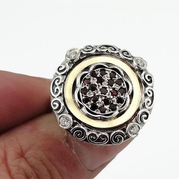 Oriental style sterling silver ring with 9K gold and Garnet gemstones.
