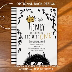 May include: A birthday invitation with the text "our little HENRY is turning THE WILD ONE". The design includes a gold crown, black and white foliage, and a black monster graphic. The invitation also includes event details.