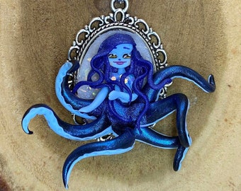 Tiny blue Lady Otcopus with her blue hair, cameo necklace, Inspired by Ursula, Fantasy doll on a stainless steel midlong necklace