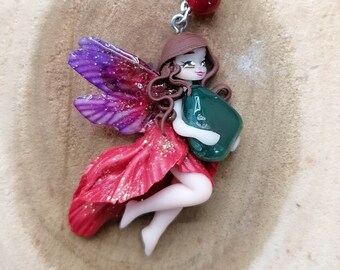 Red fairy with her brown hair holding a natural gemstone - Kawaii / fantasy jewelry - Polymer clay pendant