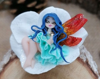 Tiny blue fairy placed in a white flower - Stainless steel pin / brooch - Polymer clay doll - Fantasy jewelry