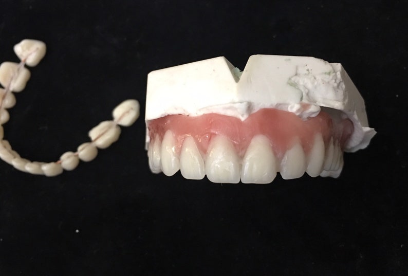 Make false teeth white