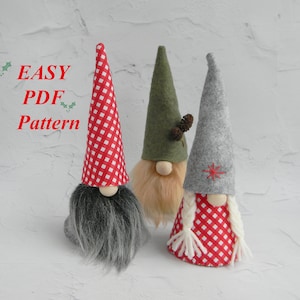 May include: Three handmade gnomes with different colored hats. The gnome on the left has a red and white gingham hat, the middle gnome has a green felt hat, and the gnome on the right has a gray felt hat with a red star.  The gnomes are all wearing white beards and have red and white gingham fabric around their bodies.  The text "EASY PDF Pattern" is visible in the image.