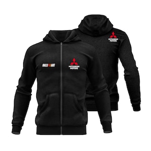 May include: Two black zip-up hoodies with the "Ralliart" and "Mitsubishi Motors" logos in white and red. The hoodies have a hood, front pockets, and a full-length zipper. The Mitsubishi logo is a red diamond shape.