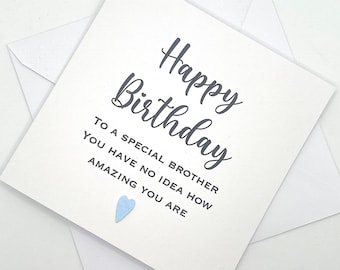May include: A square white greeting card with dark gray text that reads Happy Birthday, To a special brother, You have no idea how amazing you are. A small light blue heart is positioned below the text, and a white envelope is underneath.