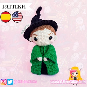 May include: Crocheted amigurumi doll of a young wizard wearing a black pointed hat and a green robe. The doll has brown hair, a white face, and black eyes. The doll is standing on a pink background with a pattern of hearts and stars.