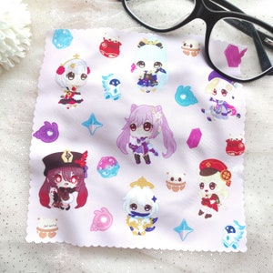 May include: A pink microfiber cleaning cloth with a white border and a variety of colorful cartoon characters and designs. The characters are all wearing different outfits and have different expressions. The designs include stars, hearts, and other geometric shapes.