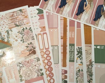 May include: A collection of planner stickers with a wedding theme. The stickers feature illustrations of a couple, floral designs, and various functional elements in shades of pink, green, and gold. Some stickers have text, including "Today" and "Next Week."