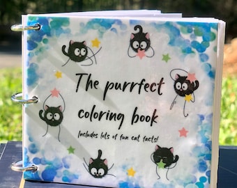 May include: A small, white, spiral bound coloring book with a blue and white watercolor background. The cover features black cats with stars and the text "The purrfect coloring book includes lots of fun cat facts!"