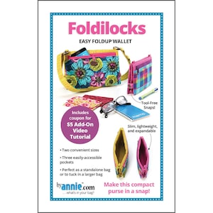 May include: An advertisement for the Foldilocks easy fold-up wallet. The image shows a variety of wallets in different colors and patterns, including a floral print and a plaid design. The ad highlights features like tool-free snaps and a video tutorial.