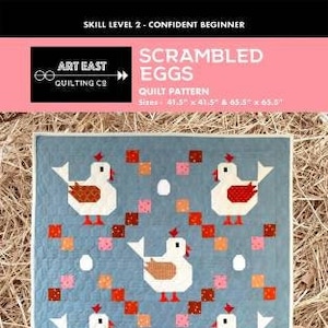 May include: A blue quilt pattern with a design of white chickens with red and brown accents, surrounded by red, pink, and orange squares, and white egg shapes. The text "SCRAMBLED EGGS" and "QUILT PATTERN" are visible.