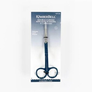 May include: Blue 6-inch double-curved applique scissors with a silver blade and comfortable handles. The packaging features the text "Kimberbell Double-Curved Applique Scissors 6" Left Handed" and "Kimberbell.com".