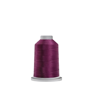May include: A spool of dark purple thread, ideal for sewing and embroidery projects. The thread is tightly wound on a white plastic base with a gray top. The thread has a shiny, smooth texture, perfect for various fabric types.