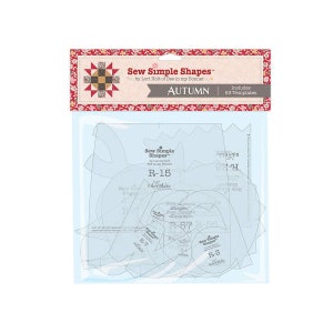 Könnte beinhalten: Sew Simple Shapes Quiltvorlagen in einer durchsichtigen Plastikverpackung mit dem Titel "Herbst" und "Enthält 63 Vorlagen". Die Vorlagen sind mit den Buchstaben "R" und einer Zahl gekennzeichnet, zum Beispiel "R-15".